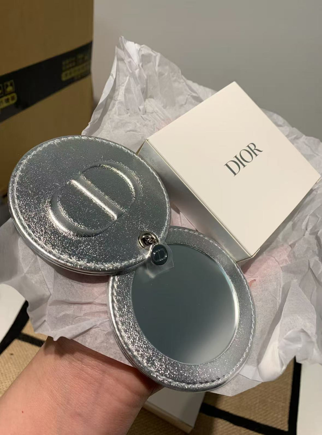 D-IOR silver lambskin compact mirror – complimentary VIP gift.