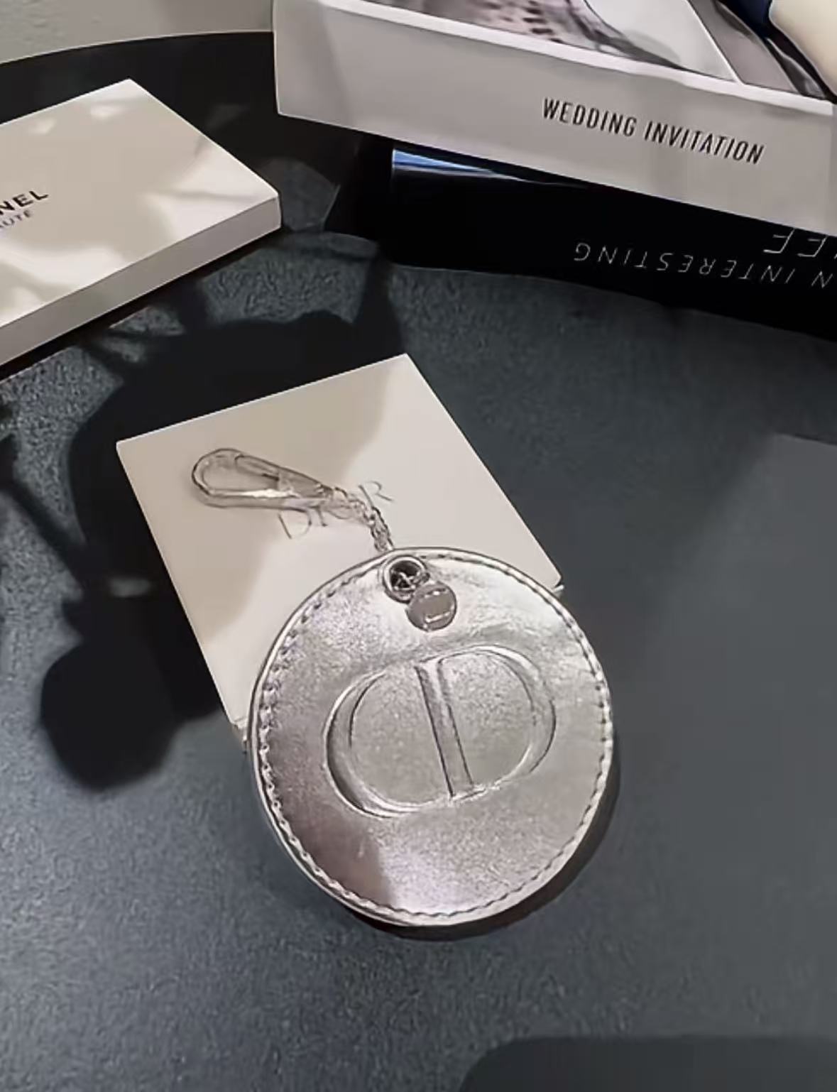 D-IOR silver lambskin compact mirror – complimentary VIP gift.
