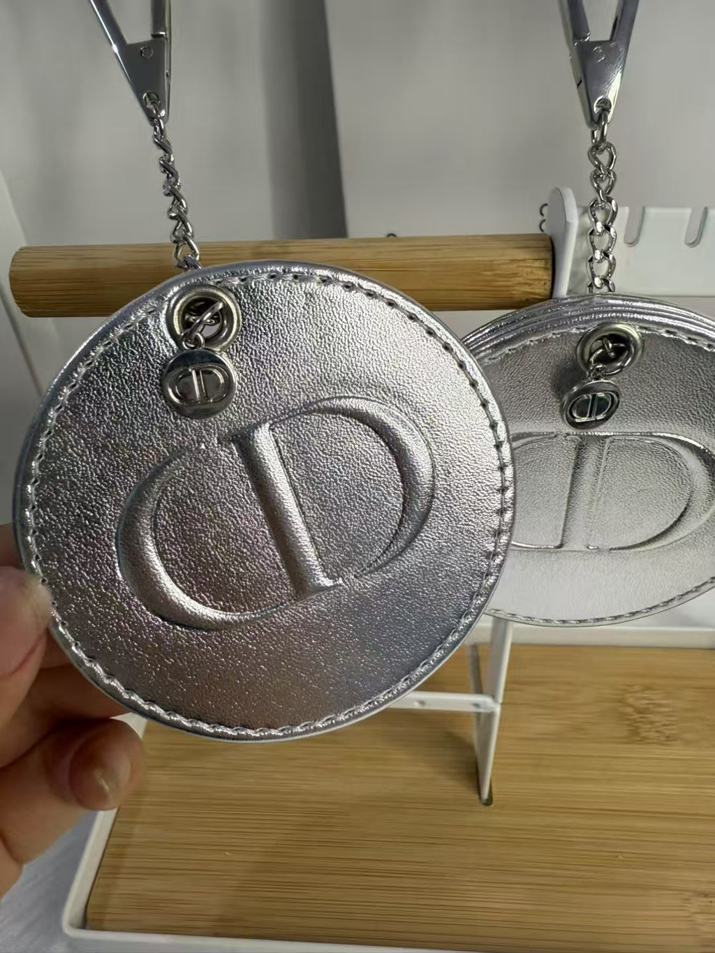 D-IOR silver lambskin compact mirror – complimentary VIP gift.