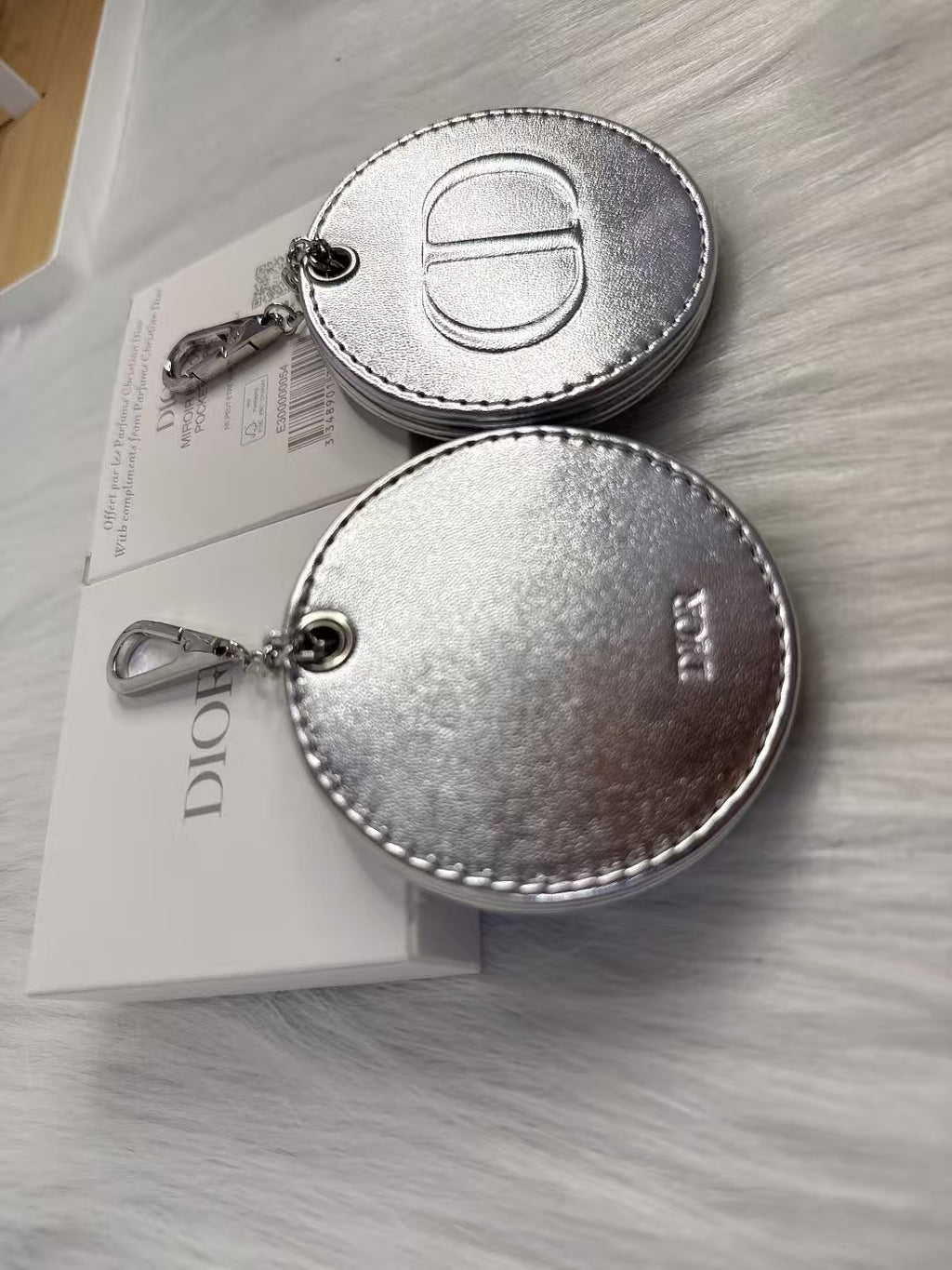 D-IOR silver lambskin compact mirror – complimentary VIP gift.