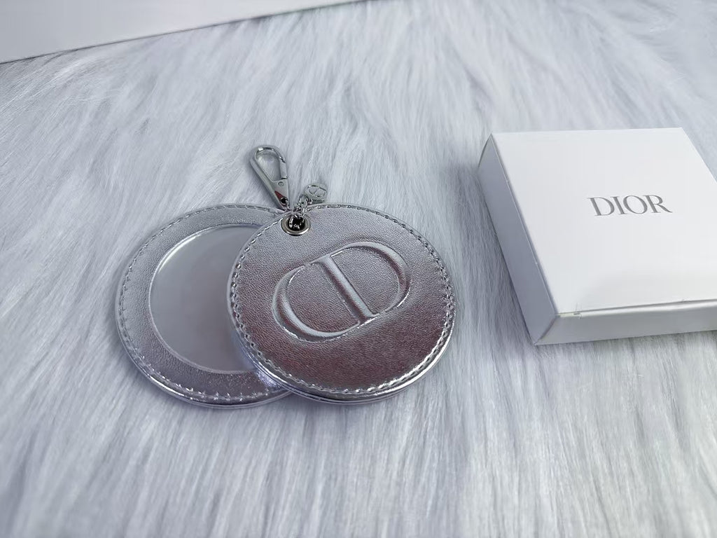 D-IOR silver lambskin compact mirror – complimentary VIP gift.